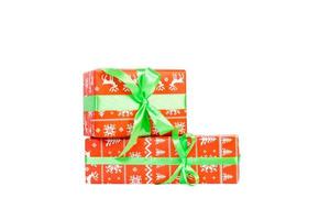 Group of Christmas or other holiday handmade present in red paper with green ribbon. Isolated on white background, top view. thanksgiving Gift box concept photo