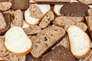Sliced white and brown loaf of bread photo
