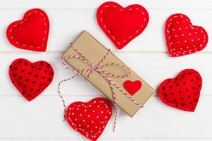 Valentine day background with hearts and gift box photo