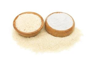 top view of rice flour wheat in a wooden bowl isolated on a white background photo