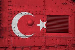 Turkey flag depicted on side part of military armored tank closeup. Army forces conceptual background photo