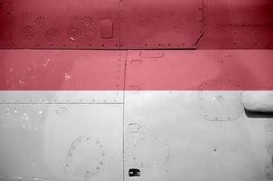 Monaco flag depicted on side part of military armored helicopter closeup. Army forces aircraft conceptual background photo