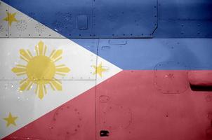 Philippines flag depicted on side part of military armored helicopter closeup. Army forces aircraft conceptual background photo