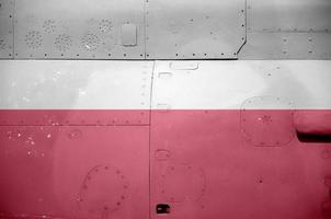 Poland flag depicted on side part of military armored helicopter closeup. Army forces aircraft conceptual background photo