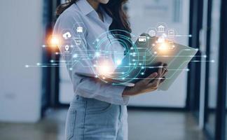 Cybersecurity and privacy concepts to protect data. Lock icon and internet network security technology. Businessman protecting personal data on smart phone with virtual screen interfaces. photo