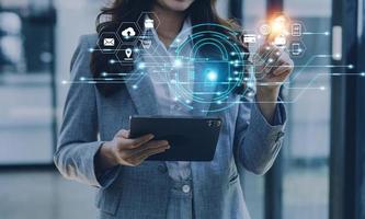 Cybersecurity and privacy concepts to protect data. Lock icon and internet network security technology. Businessman protecting personal data on smart phone with virtual screen interfaces. photo
