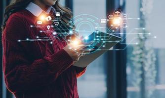 Cybersecurity and privacy concepts to protect data. Lock icon and internet network security technology. Businessman protecting personal data on smart phone with virtual screen interfaces. photo