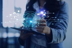Cybersecurity and privacy concepts to protect data. Lock icon and internet network security technology. Businessman protecting personal data on smart phone with virtual screen interfaces. photo