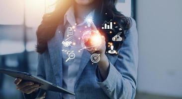 woman Hand holding virtual Global Internet connection metaverse. Business global internet connection application technology and digital marketing, Financial and banking, Digital link tech, big data. photo