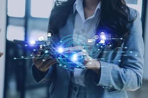 Cybersecurity and privacy concepts to protect data. Lock icon and internet network security technology. Businessman protecting personal data on smart phone with virtual screen interfaces. photo