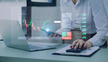 planning analyze indicator and strategy buy and sell, Stock market, Business growth, progress or success concept. Businessman or trader is pointing a growing virtual hologram stock, invest in trading photo