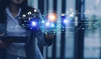 Cybersecurity and privacy concepts to protect data. Lock icon and internet network security technology. Businessman protecting personal data on smart phone with virtual screen interfaces. photo