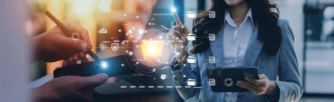 Document management system concept, Businessman signs electronic documents on digital documents, searching and managing files online document database, for efficient archiving and company data photo
