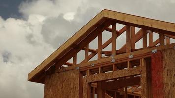 Abstract Clouds Time lapse and New Home Construction Site Framing. video