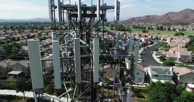 Aerial of Cellular Wireless Mobile Data Tower with Neighborhood Surrounding video