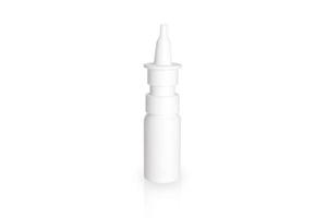 White plastic nasal spray bottle isolated on white background. Nasal spray container, saline water solution for nose congestion treatment. Runny nose, colds. Free space, copy space. photo