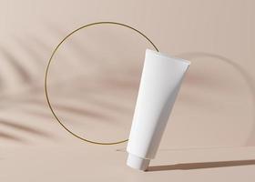 White and blank, unbranded cosmetic cream tube with golden ring and plants shadows. Skin care product presentation on light brown background. Luxury mockup. Tube with copy space. 3D rendering. photo