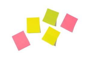 Five sheets of note papers, ready for your message. Sticky notes isolated on white background. Pink, green and yellow colors. Copy space. photo