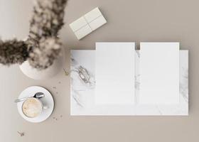 Two white vertical flyer mock ups with vase and other home accessories on beige table. Paper sheet, blank template for your design. Top view, close-up. Brochure, invitation presentation. 3D rendering. photo