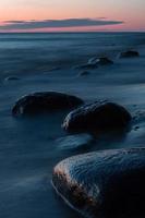 Stones on The Coast of The Baltic Sea at Sunset photo