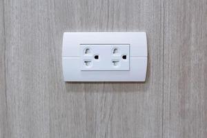 Plug Into Electricity Socket the power outlets on the wood wall photo