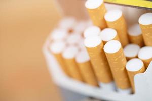 peel it off Cigarette pack prepare smoking a cigarette. Packing line up.  photo filters Natural light. soft focus
