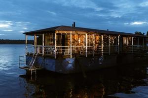 barge-based floating hotel on the river photo