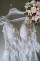 dress up the bride in a wedding dress with corset and lacing photo