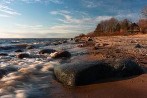 Stones on The Coast of The Baltic Sea at Sunset photo