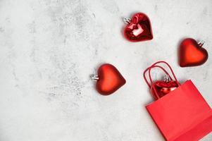 Shopping bag with hearts near.Christmas,new year,valentine day concept. Banner with place for text photo