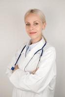 Vertical banner with young doctor smiling at camera photo