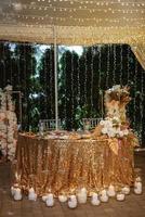 The presidium of the newlyweds in the banquet hall of the restaurant photo