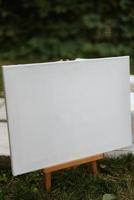 white blank sign on a wooden stand photo