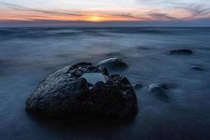 Stones on The Coast of The Baltic Sea at Sunset photo