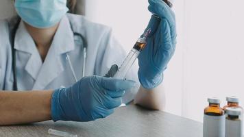 Medical Research Laboratory Portrait of a Female Scientist Wearing Face Mask Using Micro Pipette for Analysis. Advanced Scientific Lab for Medicine, Biotechnology Development.  Shot video