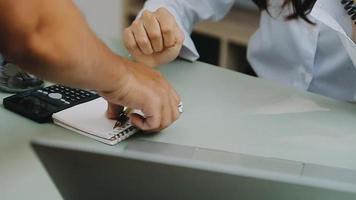 Business people using tablets And using his finger to touch the screen With a business graph showing up in a virtual screen.New startup ideas and business growth concept. video