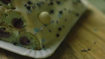 Cake with green dough, sour cherries and sour cream. It also has food ornament and the red star cake video