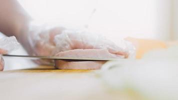 The chef cuts the sweet potatoes into slices. Romantic atmosphere in the background video