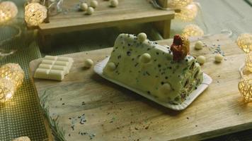 Cake with green dough, sour cherries and sour cream. It also has food ornament and the red star cake video