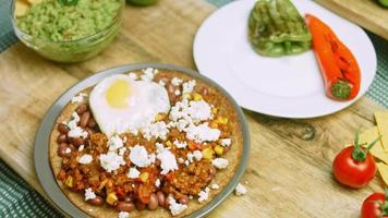 Huevos rancheros with heart-shaped egg. Mexican atmosphere