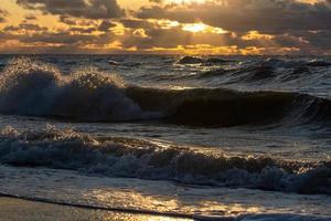 Baltic Sea Coast With Pebbles And Ice at Sunset photo