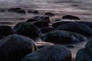 Stones on The Coast of The Baltic Sea at Sunset photo