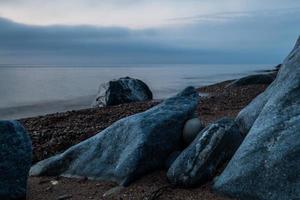 Stones on The Coast of The Baltic Sea at Sunset photo