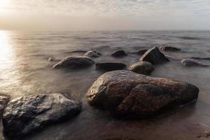 Stones on The Coast of the Baltic Sea at Sunset photo