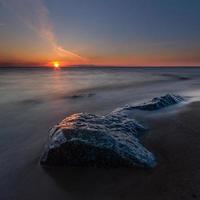 Stones on The Coast of The Baltic Sea at Sunset photo