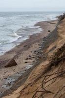 Baltic Sea Coast With Pebbles And Ice at Sunset photo