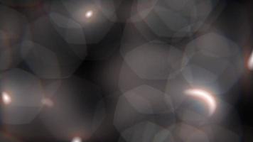 Movement of defocused light highlights of geometric diamond shape on a dark background video