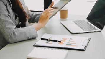 Businessman working with smart phone and laptop and digital tablet computer in office with digital marketing video