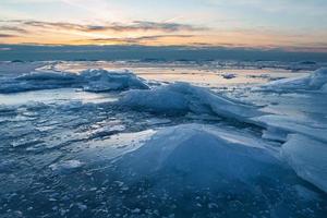 Baltic Sea Coast in Winter With Ice at Sunset photo