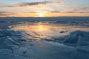 Baltic Sea Coast in Winter With Ice at Sunset photo